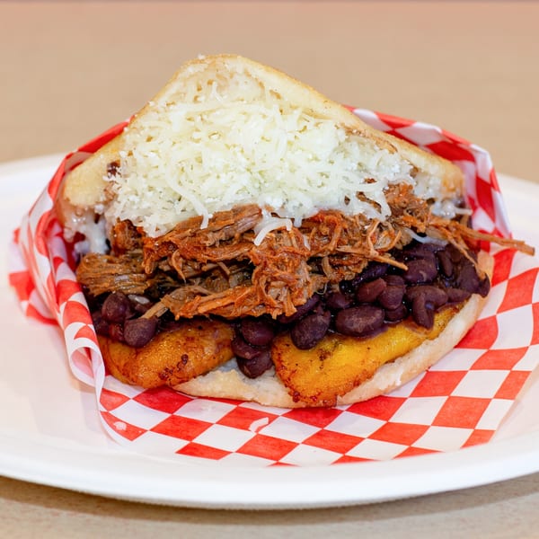 Venezuelan Chamo Cuisine's Arepa with shredded beef, black beans, plantains, and shredded cheese.