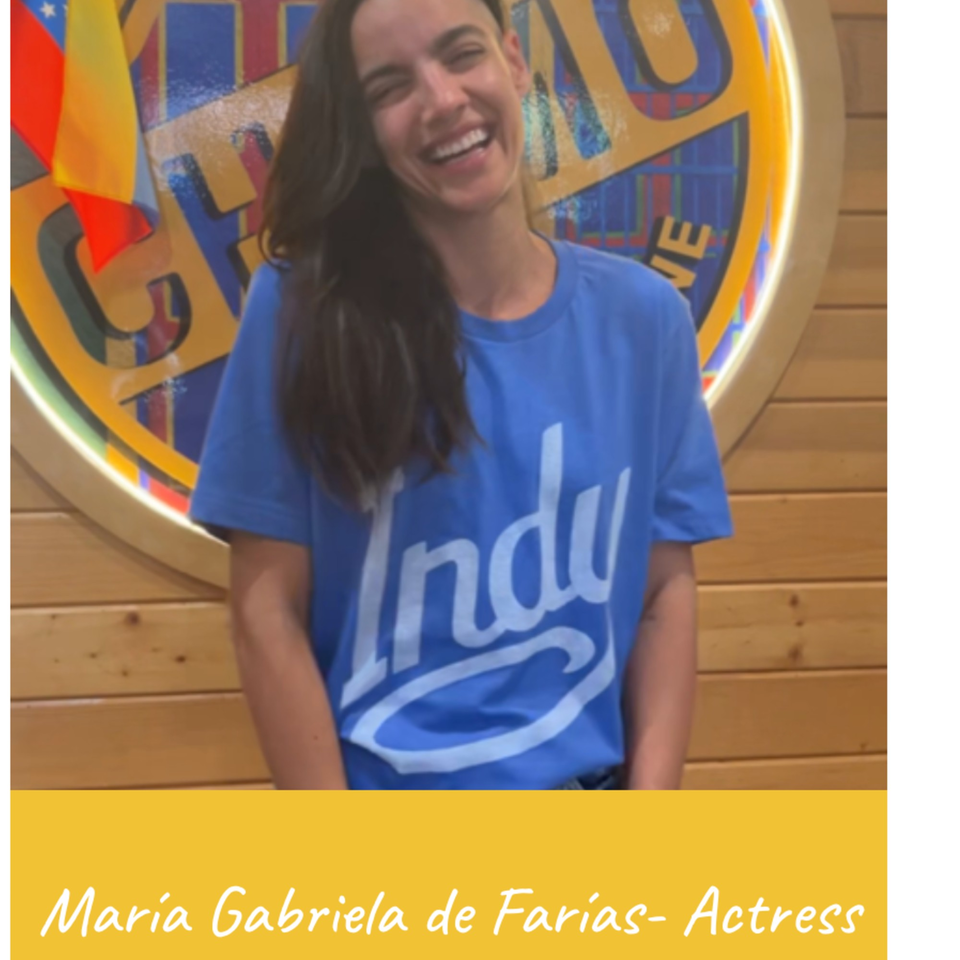 Venezuelan actress Maria Gabriela de Farias smiling in a blue t-shirt at Venezuelan Chamo Cuisine.